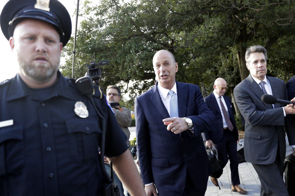 Gordon Sondland walks with security on 10-17-19